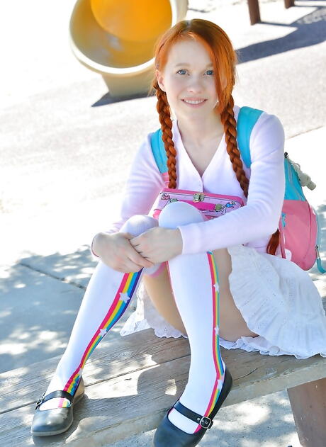 Slim american redhead teen Dolly Little revealing tiny tits and loving dildo outside